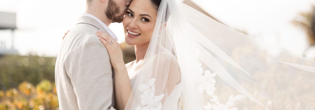 Romantic wedding kiss captured during a destination beach wedding in Punta Cana.